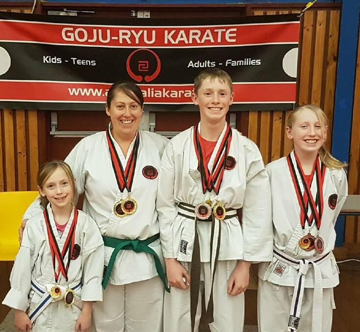 FAMILY SPORT: Phoebe, Allison, Bowen and Bethany Murray enjoy family time together at karate.