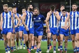 North Melbourne players were devastated after their one-point loss to Collingwood. (Joel Carrett/AAP PHOTOS)